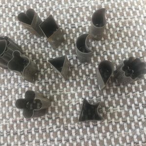 Minature cookie cutters in small tin. Vintage